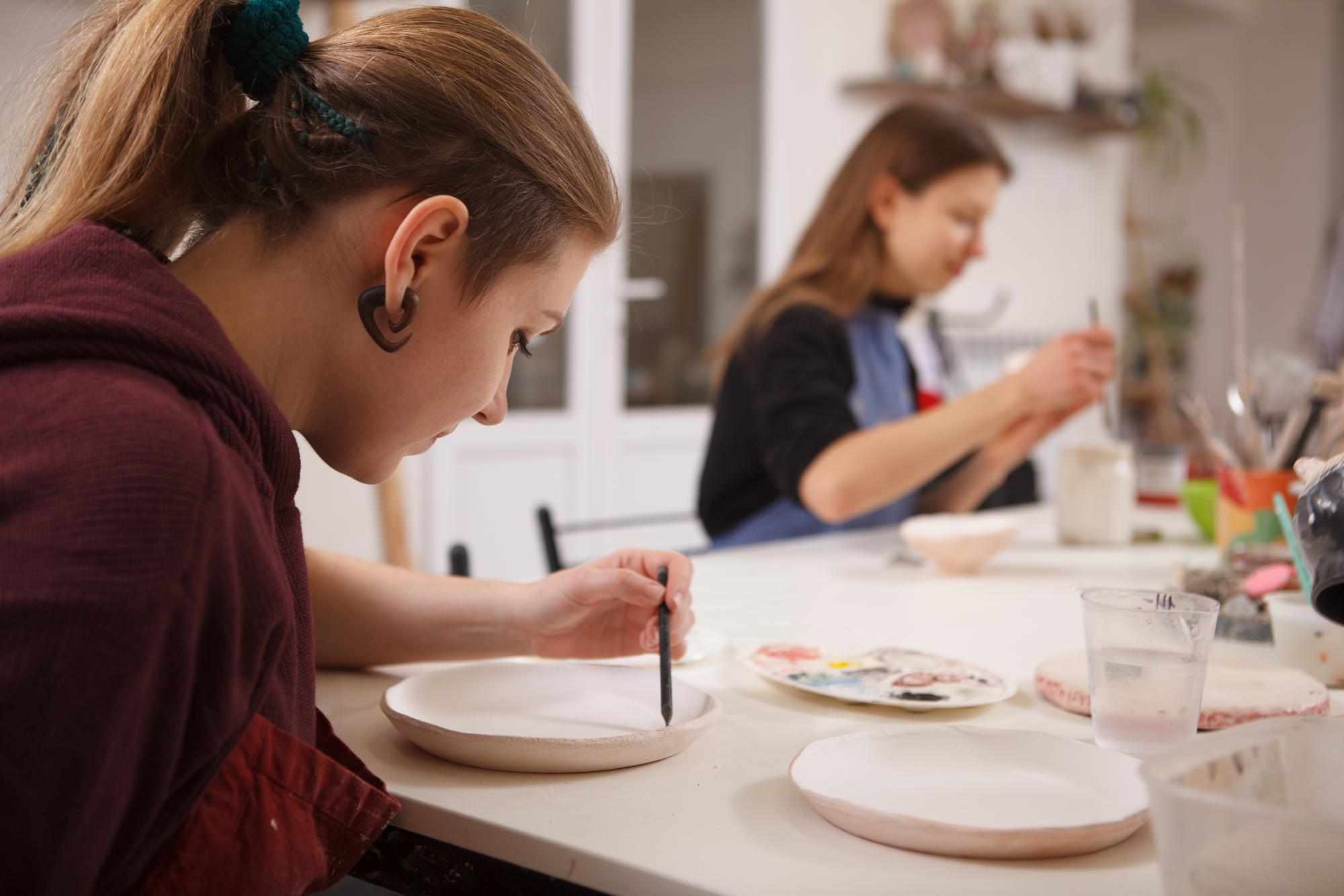 Workshop classroom with students plating